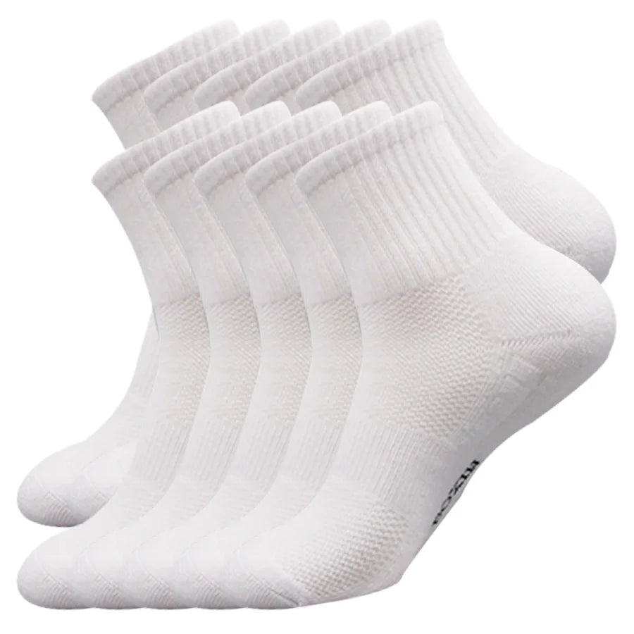 A stack of white men's essential warm socks for outdoor activities