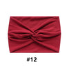 A folded maroon fabric headband with a twisted design, labeled #12.