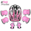 Pink kids protective gear set including a helmet, knee pads, and wrist guards for skating