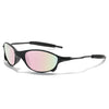 A pair of black sunglasses with a gradient pink and green lens resting on a white background.