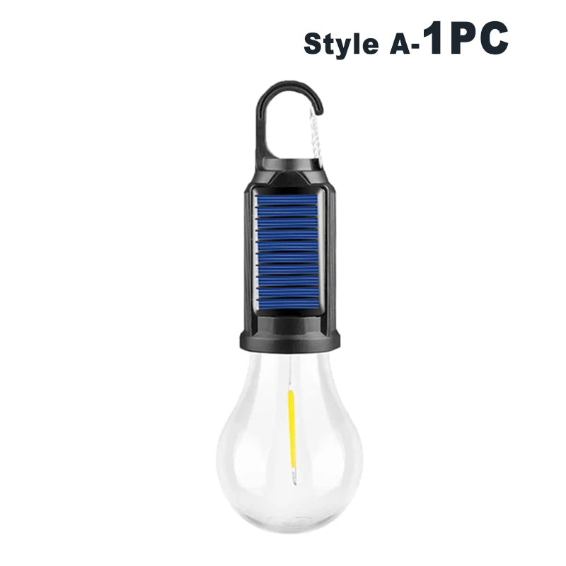 A black USB rechargeable LED camping lantern with a clear bulb and a ribbed top.