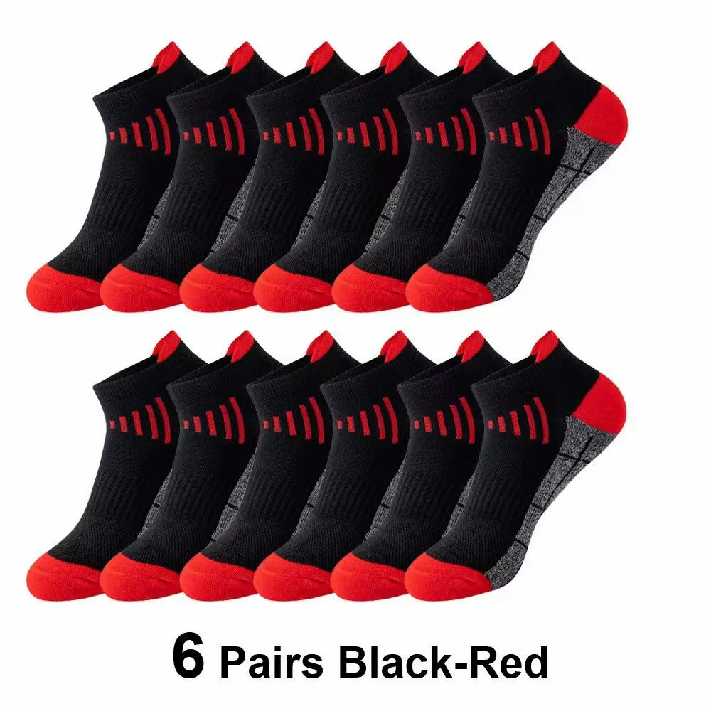 Six pairs of black and red knit sports socks laid out for display.