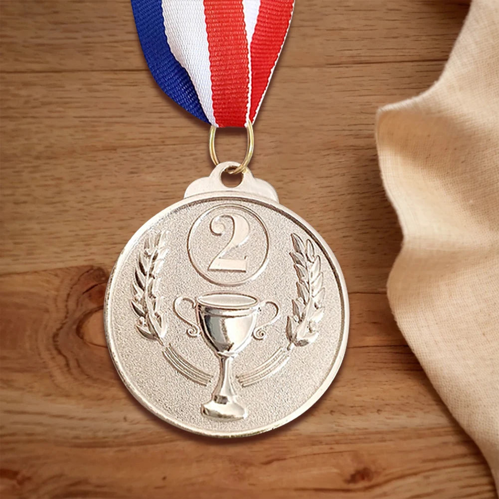 A round gold sports achievement medal with the number 2 and laurel wreaths, suspended from a red, white, and blue ribbon.