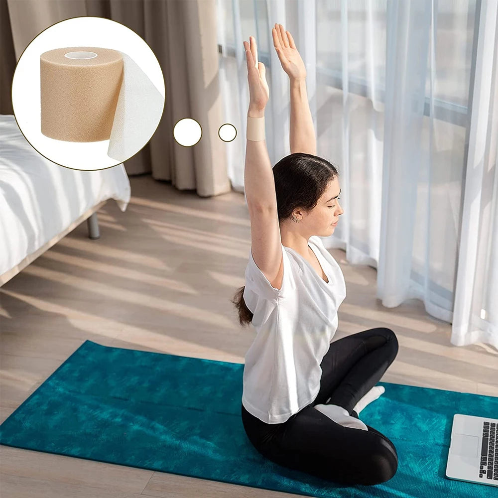 A woman performs a stretch exercise using a foam elastic skin bandage on a teal yoga mat.