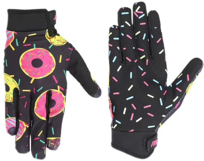 Gants de motocross noirs avec motifs de confettis rose néon et jaune sur les paumes et les doigts.