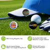 A blue golf hat with magnetic clips and a white golf ball on a green field.