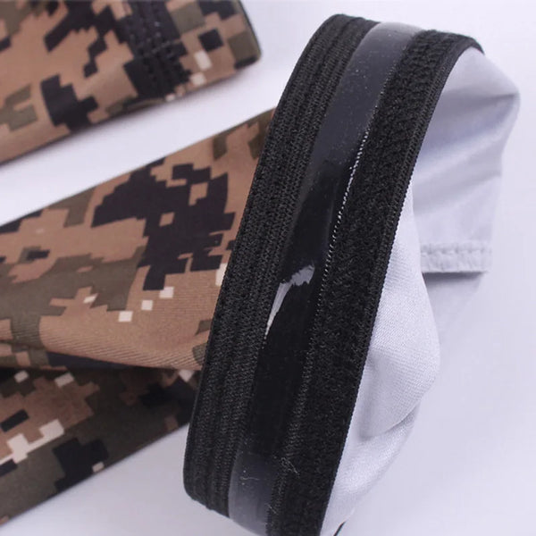 A pair of tactical camouflage arm sleeves shown folded, featuring brown and black patterns.