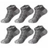 A pack of six gray athletic mesh ankle socks laid out for display.