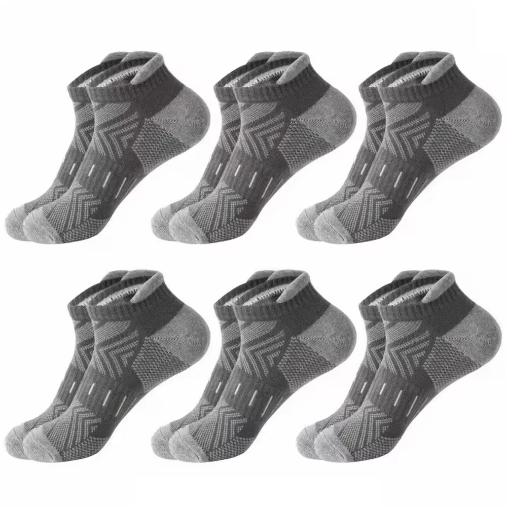 A pack of six gray athletic mesh ankle socks laid out for display.