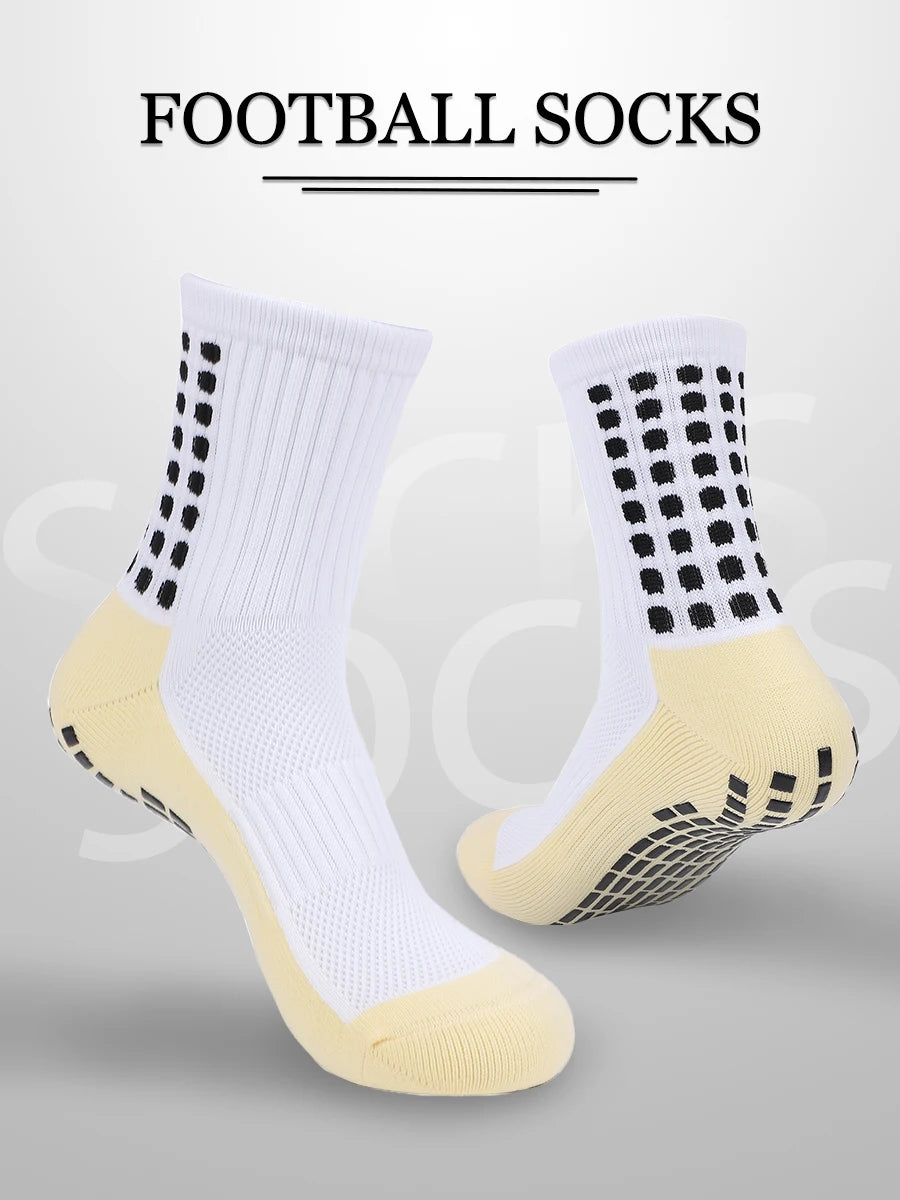 A pair of white and yellow football socks displayed against a light gray background.