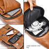 A brown leather crossbody bag showing its interior features including a zippered compartment and storage for a smartphone and