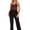 A woman models a full body shapewear bodysuit in dark brown with black pants and white sneakers.