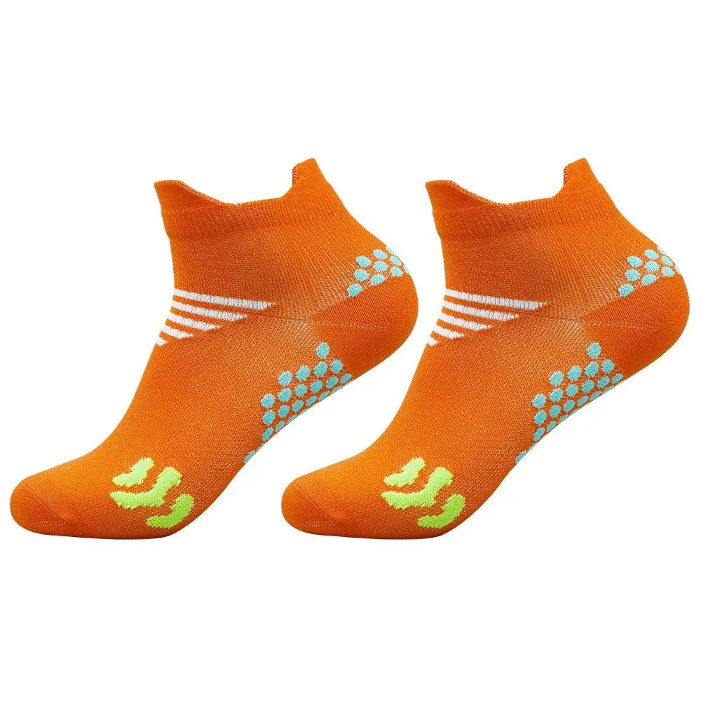 A pair of bright orange cycling and running socks with white and light blue patterned accents.