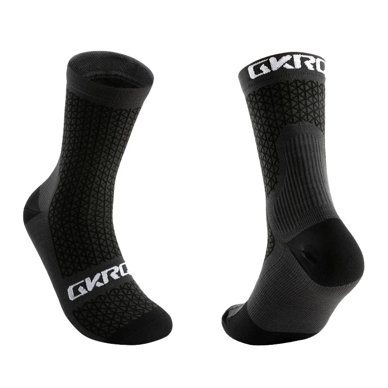 A pair of black GKRO cycling socks shown from the side.