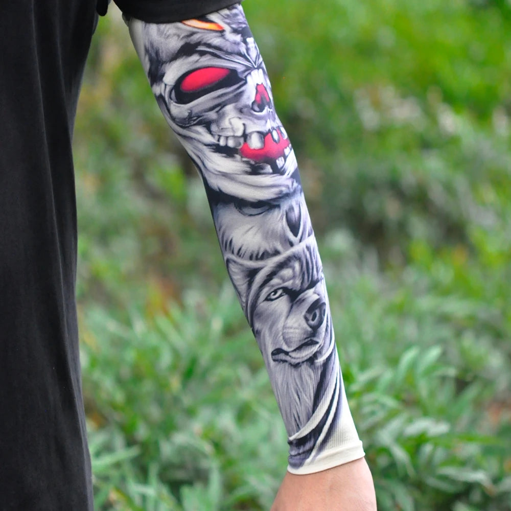 A close-up of a black sleeve featuring a detailed graphic of a skull and a wolf head.
