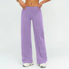 A woman is modeling purple high-waist flared yoga pants.