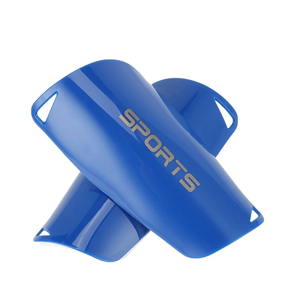 A blue soccer shin guard is shown from the side, featuring the word SPORTS printed on it.