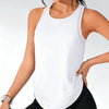 A woman wearing a white breathable sport tank top and black athletic bottoms.