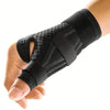 A hand is wearing a black therapeutic thumb brace for joint pain relief.