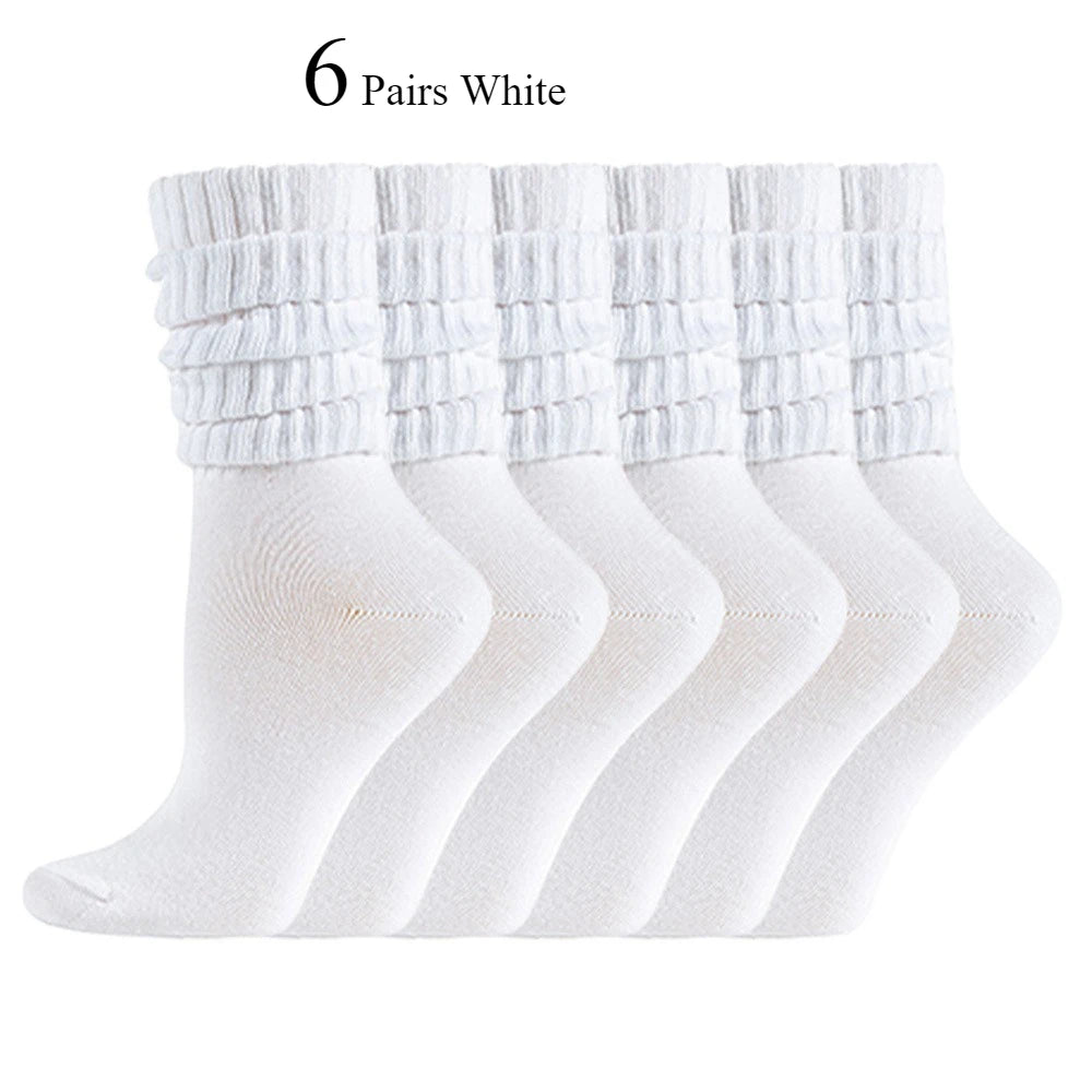 Un juego de seis pares de calcetines de punto blancos para mujer hasta media pantorrilla, mostrados en fila.