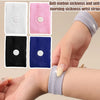 A hand is wearing a gray wrist strap, demonstrating an anti motion sickness and anti morning sickness wrist strap product.