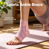 A person wearing a pink sports ankle brace while practicing yoga on a pink mat.