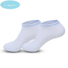 زوج من جوارب غير قابلة للانزلاق بيضاء لليوغا والبيلاتس