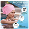 A woman wearing a pink silicone swim cap, demonstrating how to put it on for keeping hair dry.