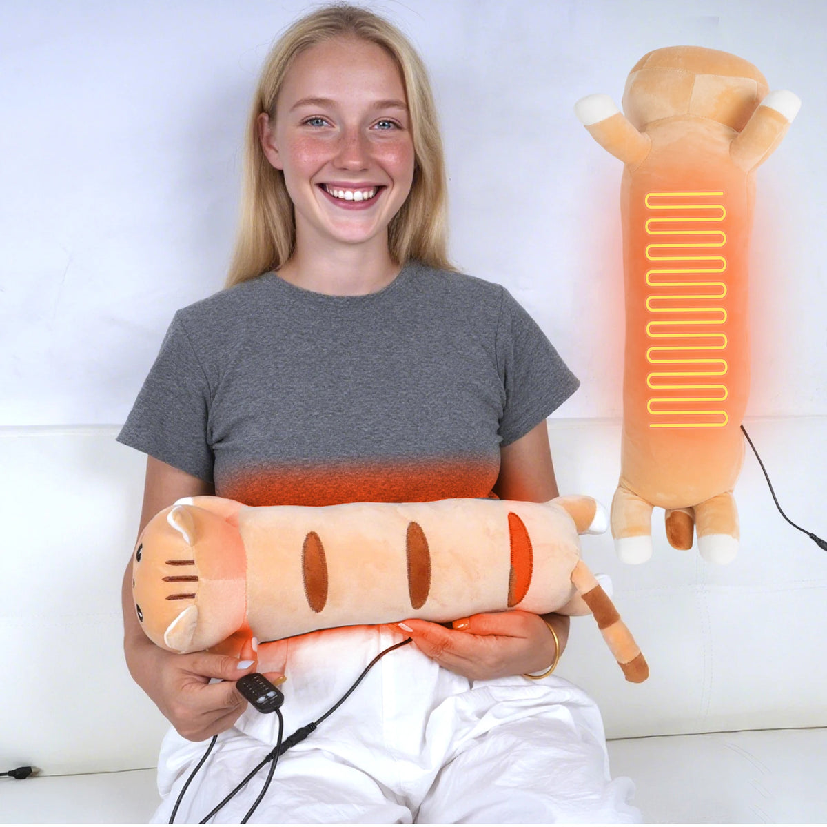A young woman is holding an orange heating pad for muscle relief, with another similar device visible in the background.