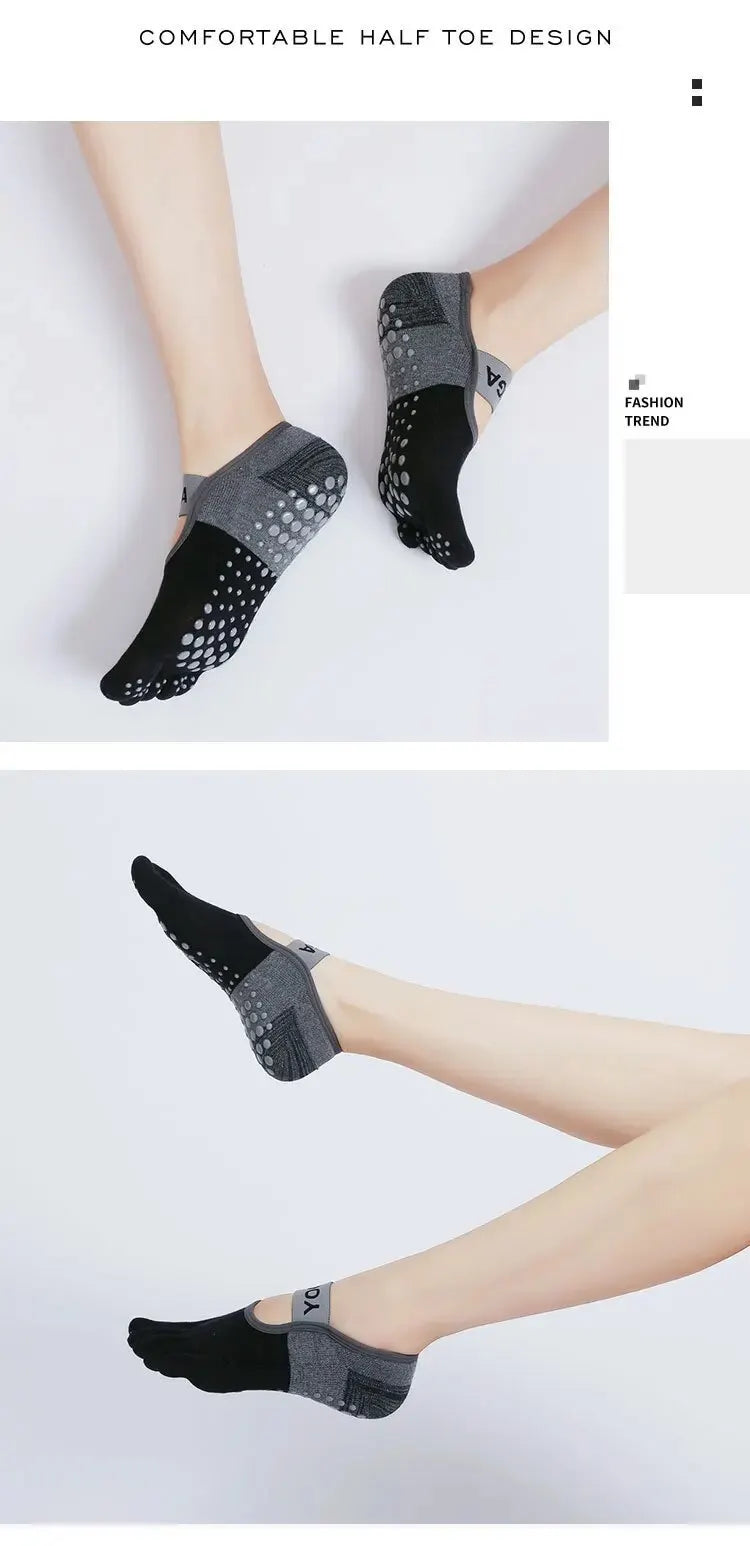 A pair of black and gray half toe design yoga socks worn on a foot.