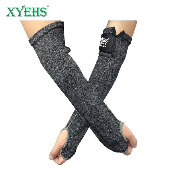 A pair of dark gray cut resistant arm sleeves crossed on a person's arm.