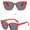 Red cat eye vintage sunglasses with gradient lenses shown from the front and side.