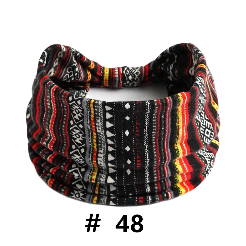A black and multicolored knitted headband with geometric patterns for yoga or workout.