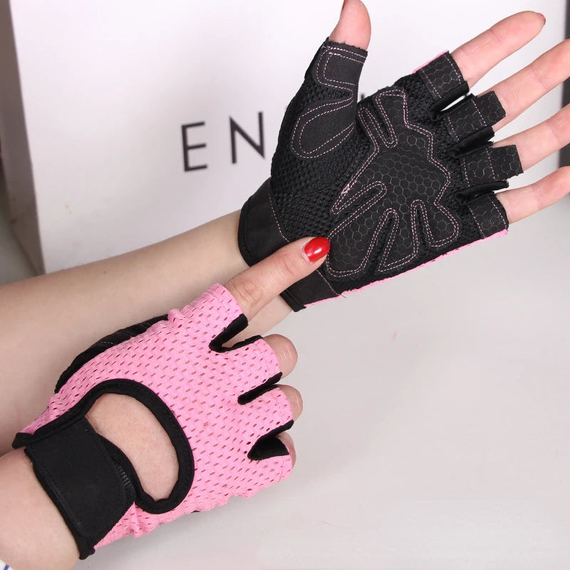 A hand wearing a pink anti-slip fingerless gym glove with black wrist support.
