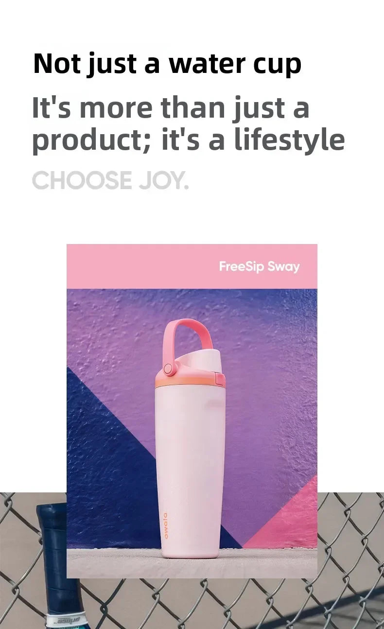 A pink insulated stainless steel travel mug is displayed against a purple and blue geometric background.