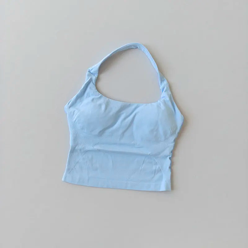 Light blue seamless yoga and pilates sports bra shown flat lay