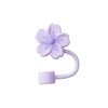 A purple silicone butterfly straw cover for tumblers.