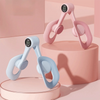 A pair of pink and light blue thigh and hip strength trainers are displayed on a pink pedestal.