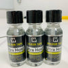 Three glass bottles of Walker Tape Ultra Hold system adhesive for hair replacement wigs