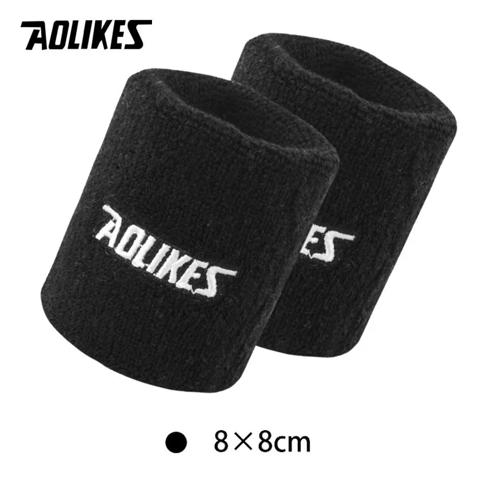 A pair of black durable sport wristbands shown flat, measuring 8x8cm.