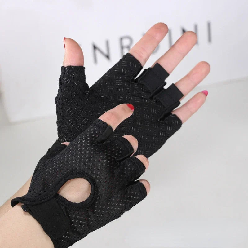Black anti-slip fingerless gym gloves with wrist support worn on a hand.