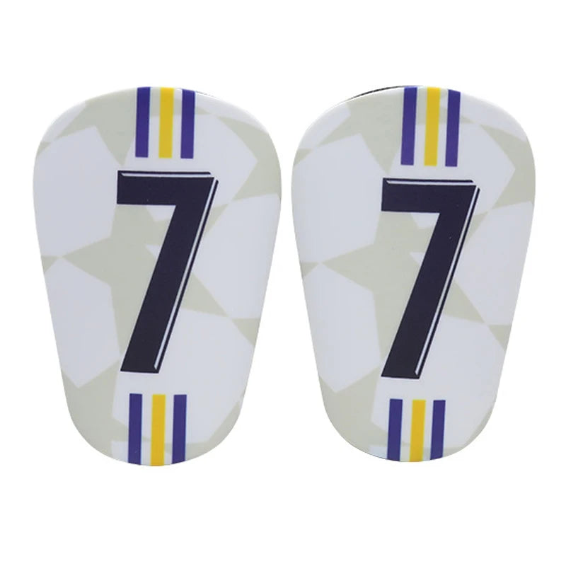 A pair of mini football shin guards featuring the number 7 in dark blue and yellow stripes on a white background.