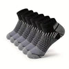 A stack of black and gray athletic knit ankle socks for men displayed on a white background.