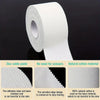 Roll of white natural cotton material used as a base for sports tape