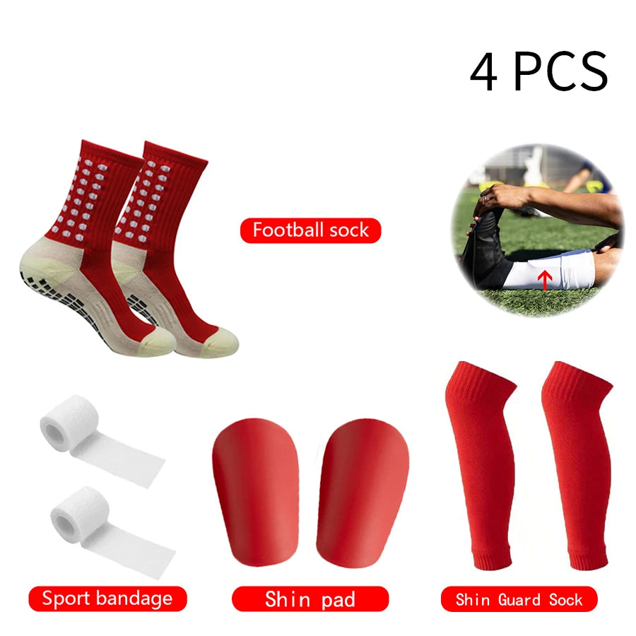 Four pairs of red football socks, shin pads, and sport bandages for sports injuries.