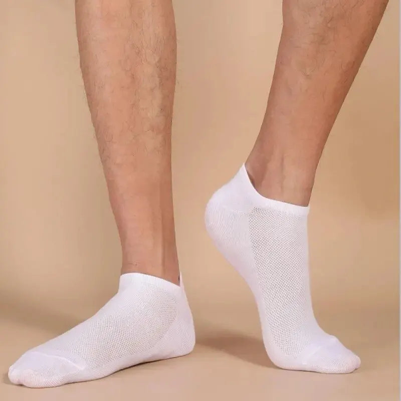 White breathable unisex boat socks worn on feet against a neutral background.