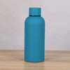 A sleek, matte blue double-layer vacuum thermos cup standing upright on a wooden surface.