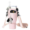 A pink neoprene water bottle carrier bag with a shoulder strap and attached keys is shown.
