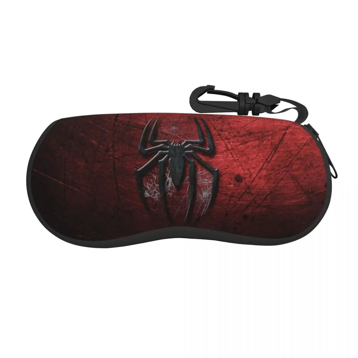 A dark red leather pouch with a black spider web design and a black strap.