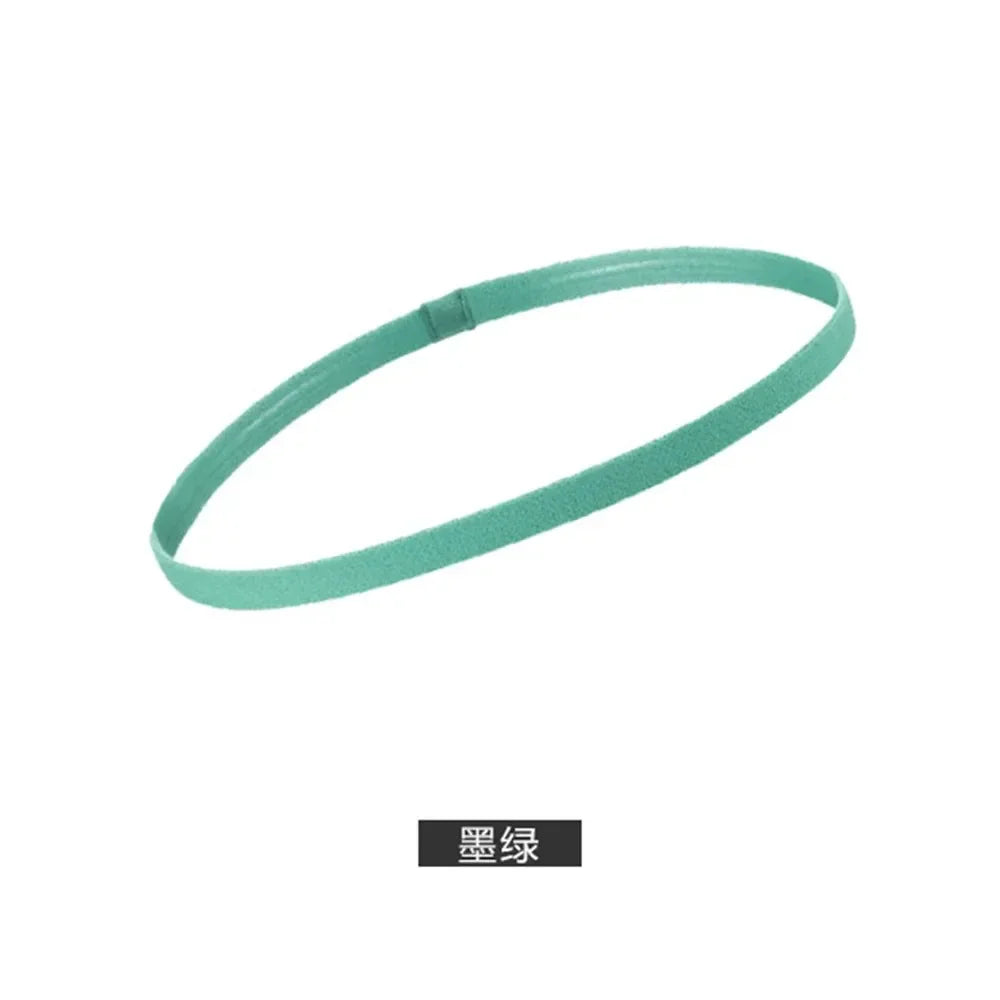 A teal silicone sports headband shown in a loop.